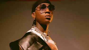 Bella Shmurda says that Olamide has benefited him more than her mother.
